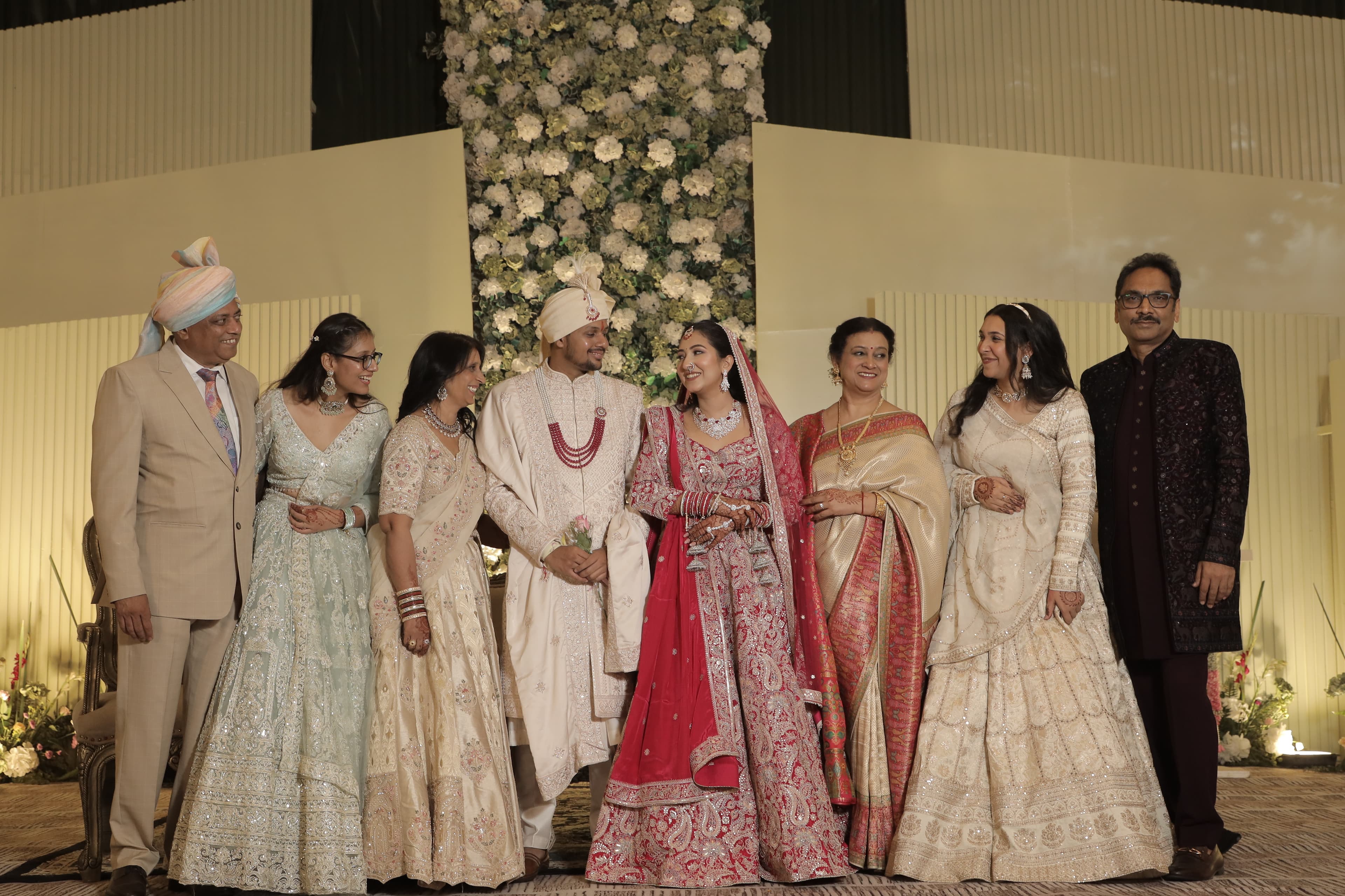 Vidhi and Sanjeev surrounded by family